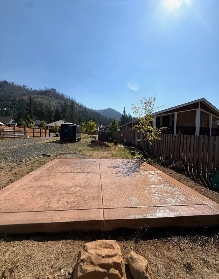 Stamped concrete surface with a stone-tile pattern and finished edge